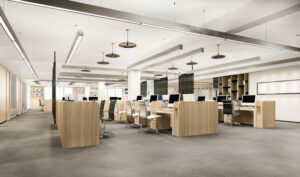 Bureaux modernes en open space avec mobilier en bois clair, chaises ergonomiques et ordinateurs alignés dans un espace lumineux.